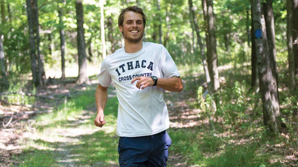Senior Sean Phillips runs on the Ithaca College Upper Terraces trail in preparation for the 2016 season.
