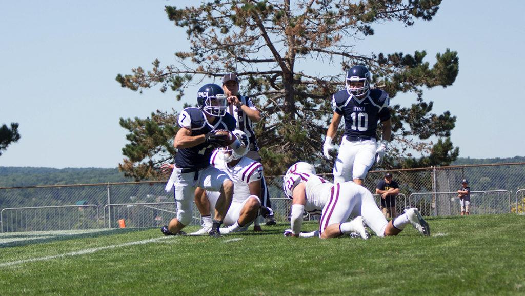 Junior+wide+receiver+JR+Zazzara+is+tackeled+at+the+1-yard+line+after+a+40-yard+reception+from+senior+quarterback+Wolfgang+Shafer+Sept.+3+in+Butterfield+Stadium.+The+Bombers+went+on+to+win+14%E2%80%939+in+their+first+game+of+the+season.