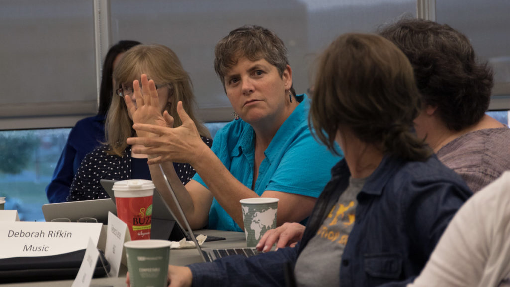 In the center, Deborah Rifkin, associate professor in the Department of Music Theory, supports the passing of the APC policy regarding student evaluations at the Sept. 6 Faculty Council meeting.