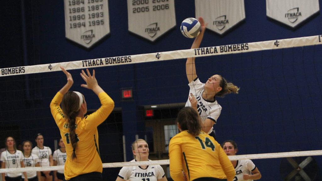 Sophomore Katie Evans goes to spike the ball against SUNY Oswego in Ben Light Gymnasium on Sept. 6. The Bombers won in three sets, and improved to 3–2 on the season.