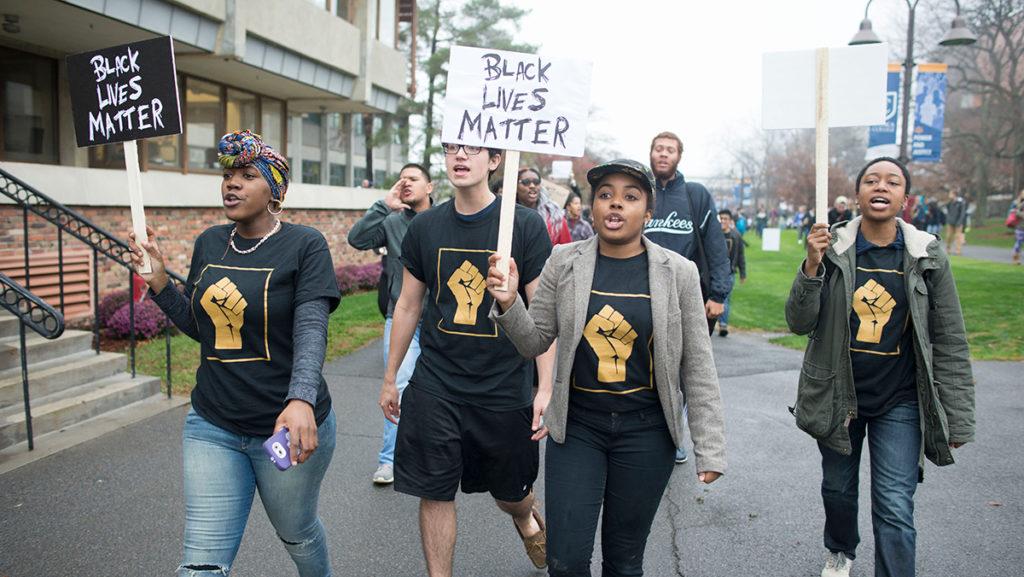 Members of POC at IC hold a “Solidarity Walk Out” on Nov. 11, in which members of the group demanded the resignation of Tom Rochon.