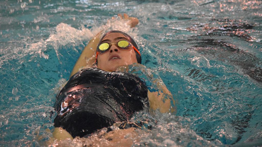 Sophomore Rachel Smertz races in the womens 100-yard backstroke Oct. 29 in the Athletics and Events Center. She placed fifth with a time of 1:04.31.