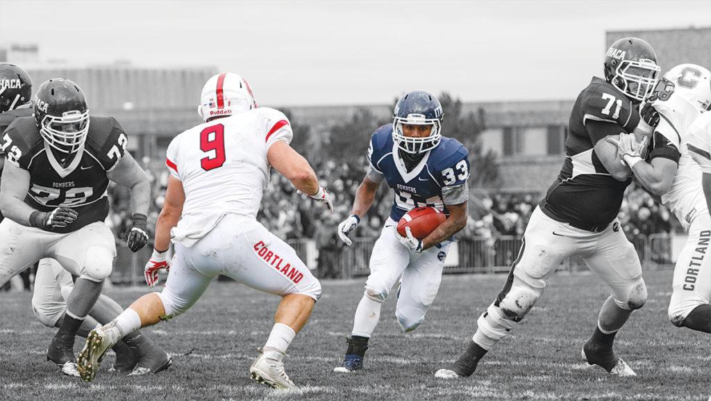 Junior running back Tristan Brown looks for an open path to run past SUNY Cortlands defense in the 57th annual Cortaca Jug on Nov. 14, 2015. 