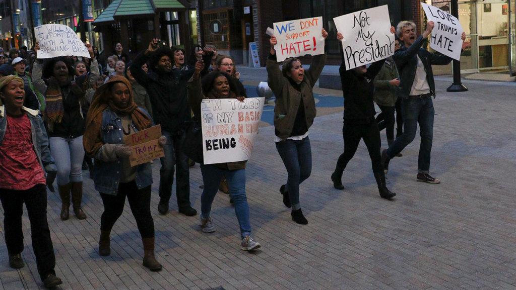 About 70 Ithaca College students rallied against Trump and hate Nov. 10 in a procession down South Hill. The group displayed signs that read, Love Trumps Hate and We Dont Support Hate.