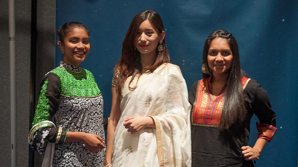 From left, senior Lima Hossain, junior Anushka Rajbhandari and sophomore Aarti Patel attend the Eid Banquet in the Emerson Suites.