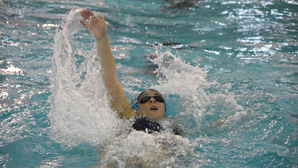 Freshman Emily Altchiler competes against Rensselear Polytechnic Institute on Oct. 29 in the Athletics and Events Center. The womens swimming and diving team will host the Bomber Invitational on Dec. 2–4 .