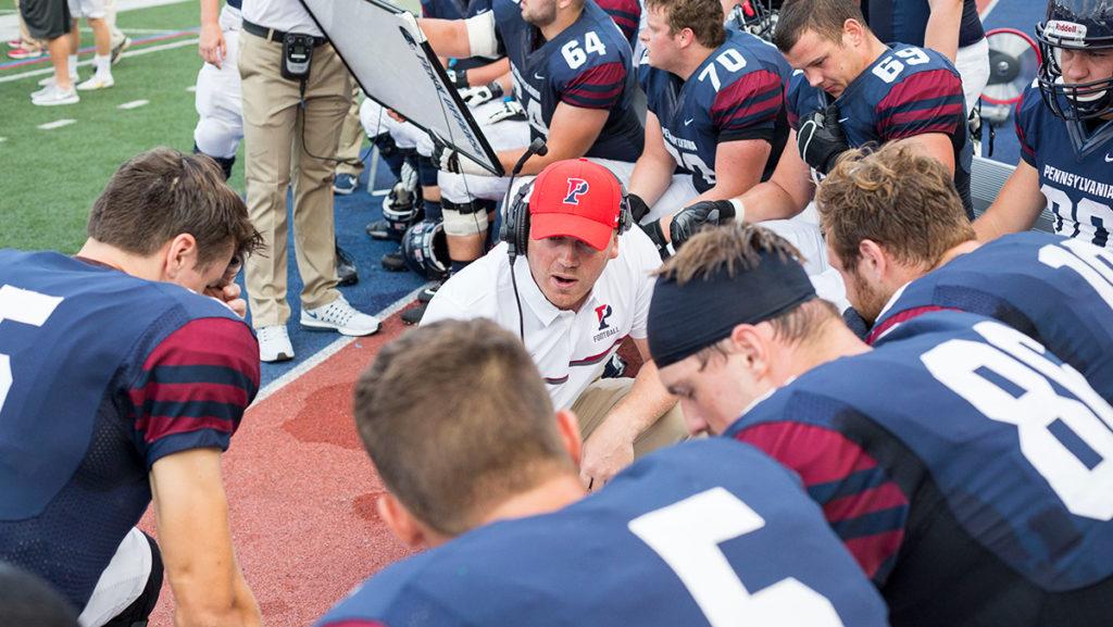 New football head coach Dan Swanstrom, center, coaches the quarterbacks at the University of Pennsylvania. He began his duties as head coach at Ithaca College on Jan. 1.