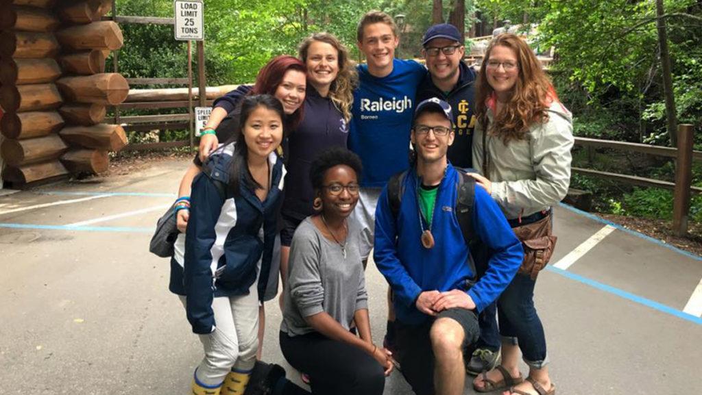 Kris Bosela (Bottom row, first from left) volunteering at Camp Campbell, a YMCA camp in Boulder Creek, California on a charter service trip with other Ithaca College students. 
