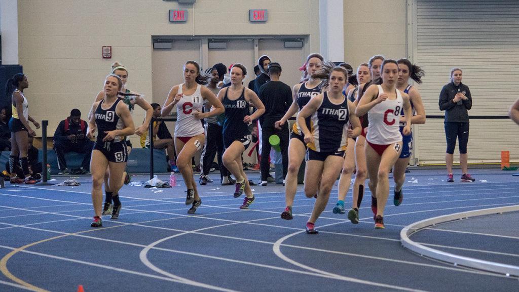 Members of the womens track team competes in the mile run at the Bomber Invitational. Sophomore Emilie Mertz placed second with a time of 5:13.16.