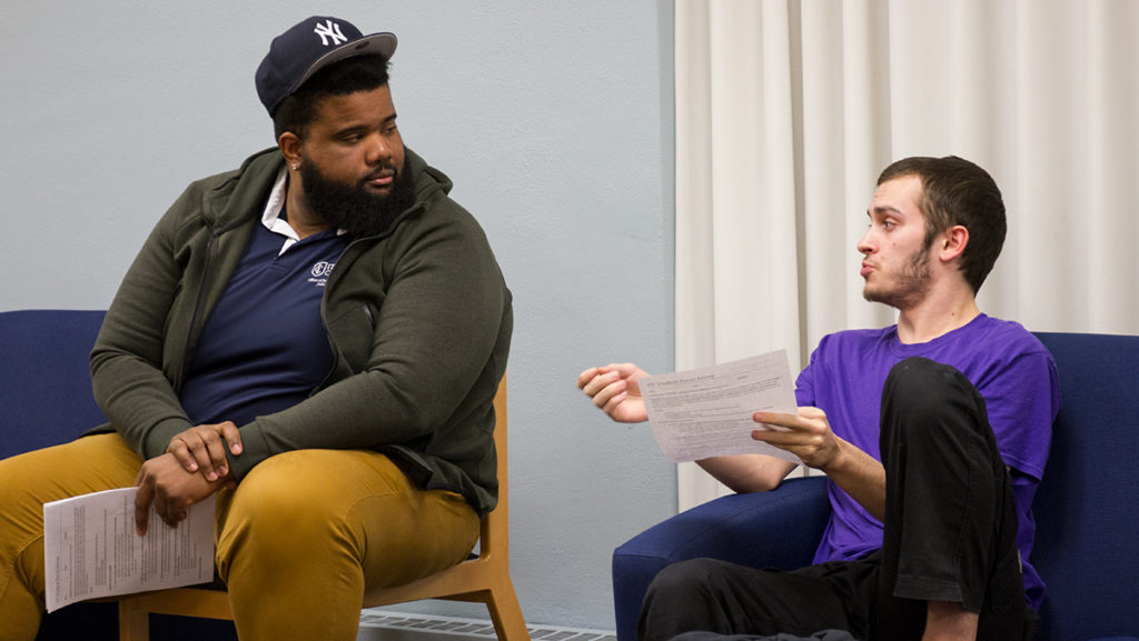 From left, Darnell Thompson, residence director, and sophomore Christopher DiNapoli discussed how an FYRE program for sophomores could help them at the college.