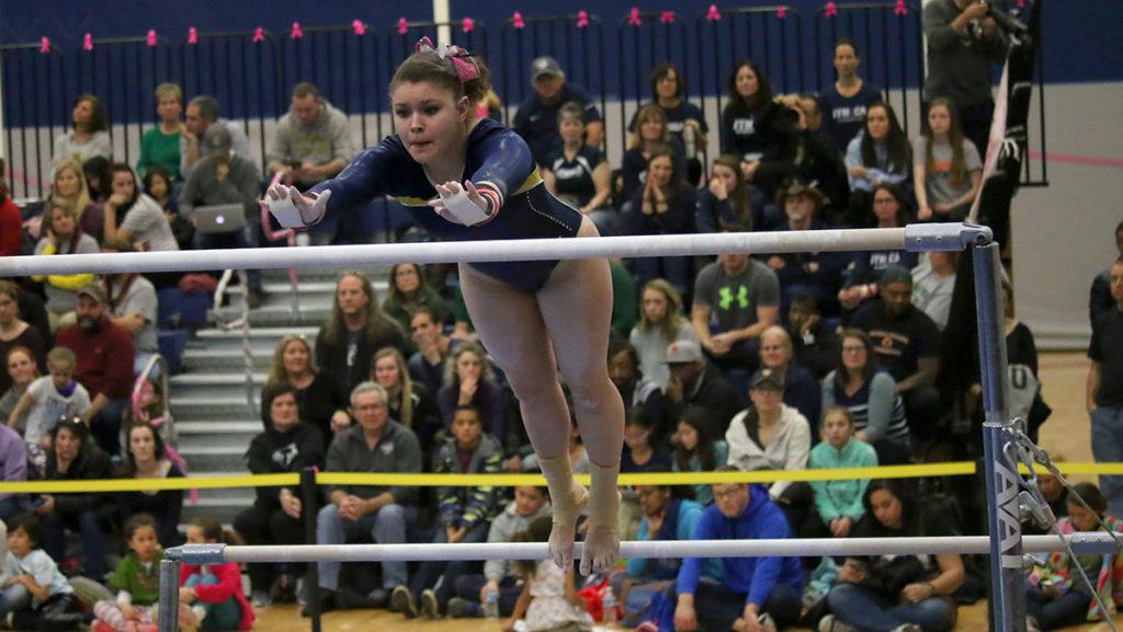Junior Kaylee Pacunas competes in the uneven bars in the Harriet Marranca Memorial Invitational Feb. 26. Pacunas finished with a score of 8.800.