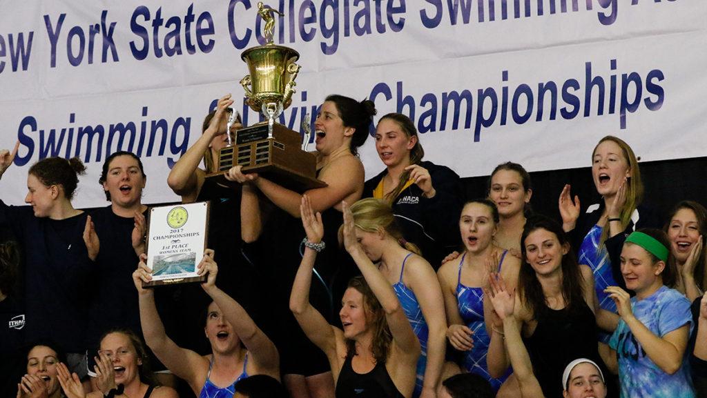 The Ithaca College womens swimming and diving team celebrates its first place finish in the UNYSCSA Championship on Feb. 18 in the Athletics and Events Center. 