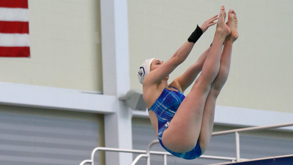Senior Nickie Griesemer dives off the one-meter diving board in the NCAA Division III Region Four Diving Championships. Griesemer finished day one in first place with 494.85 points, qualifying her for nationals.