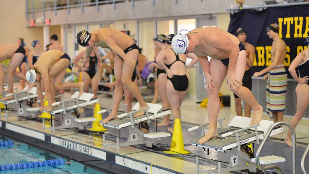 Swimmers get ready to start a race Jan. 21 agaisnt Alfred University in the Athletics and Events Center. The men’s and women’s  swimming teams are currently in taper in preparation for their championship meet Feb. 15–18. 