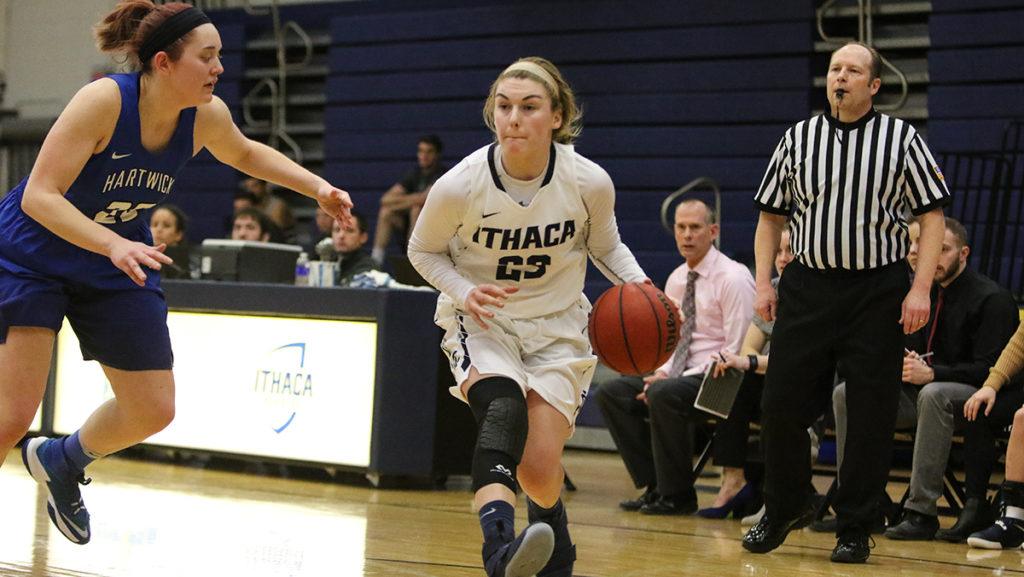 Junior guard Jordan Beers dribbles down court Feb. 11 against Hartwick College. She had a career-high 28 points.