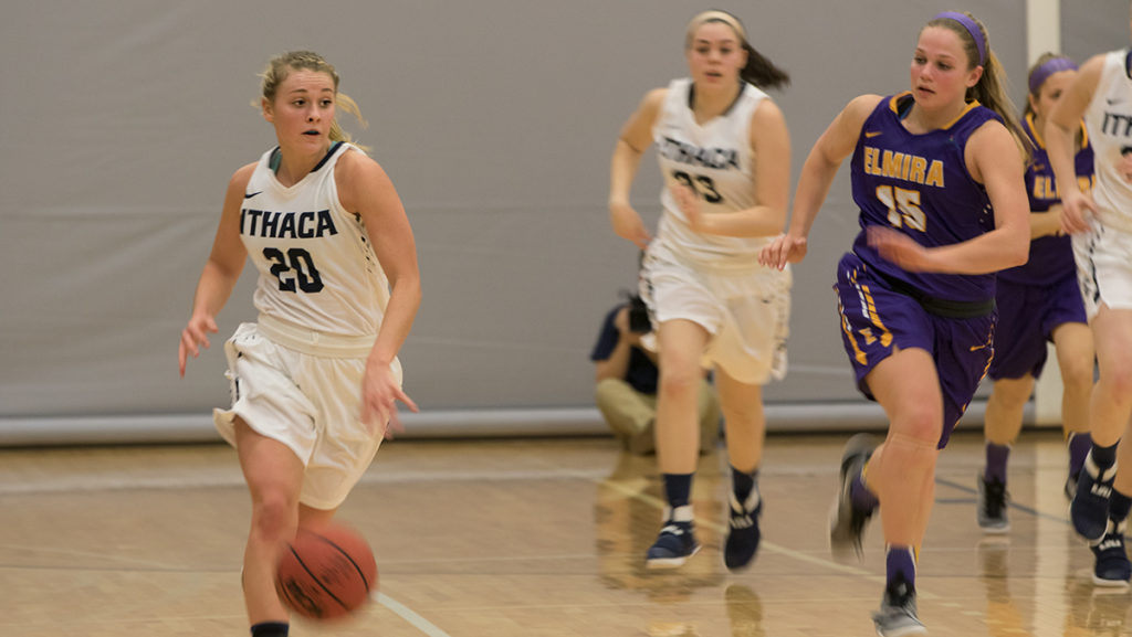 Junior guard Erin Woop dribbles down the court against Elmira College Feb. 7. Woop played for 22 minutes and had four rebounds. The Bombers won 68–60.