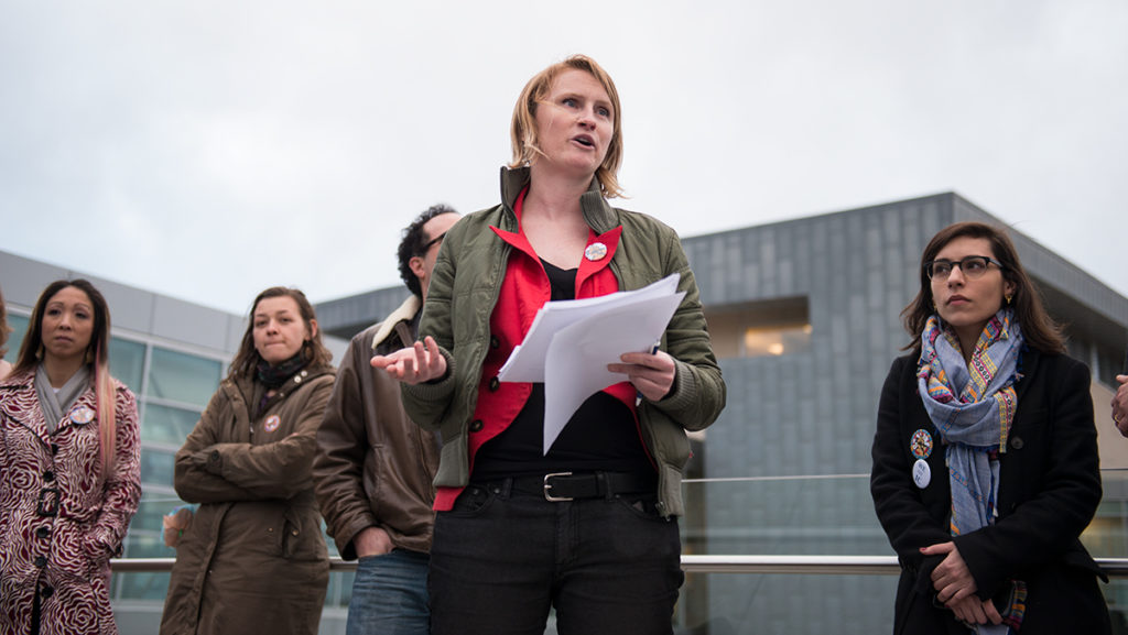 Rachel Gunderson, instructor in the Department of Health Promotion and Physical Education, addresses media at a press conference that the contingent faculty unions will be filing an unfair labor practice lawsuit against Ithaca College. 