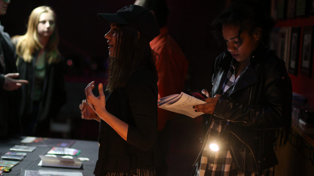 From left, sophomores Elise Littlefield and Diamond Watt volunteer at an Ithaca Underground show on Feb. 26 for hip-hop groups Milo, Elucid and Ithaca local, Sammus. The performance at The Haunt, along with many other IU shows, allow Ithaca College students to get involved in the music scene in Ithaca.
