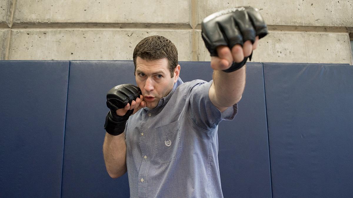 Professor writes article comparing cage fighting hobby to academia