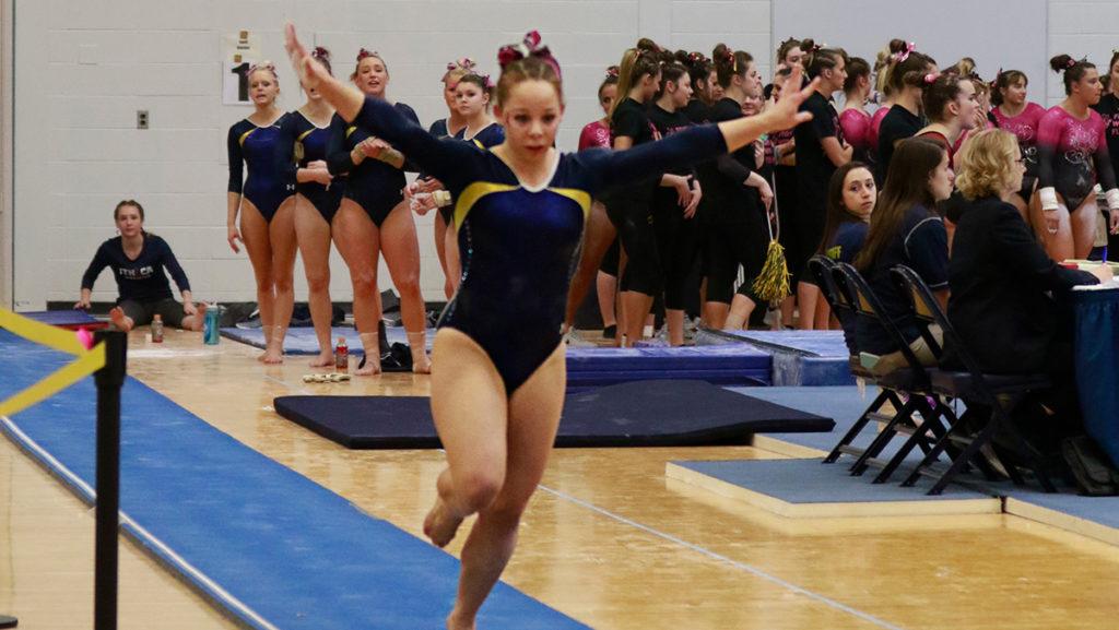 Sophomore Carolyn Nichols competes Feb. 26 in Ben Light Gymnasium. She debuted a vault that had never been preformed in Division III before. The team set a program record on vault Feb. 11 with a score of 47.850.