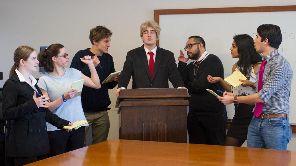 Students in Annette Levine’s Teatro: Performance and Production class take the roles of frustrated journalists speaking to President Donald Trump during their play,  “POTUS: Conferencia de Prensa.” The play, written by freshman Christopher Morales, will be performed on campus April 19 in the School of Business and April 29 in IC Square.
