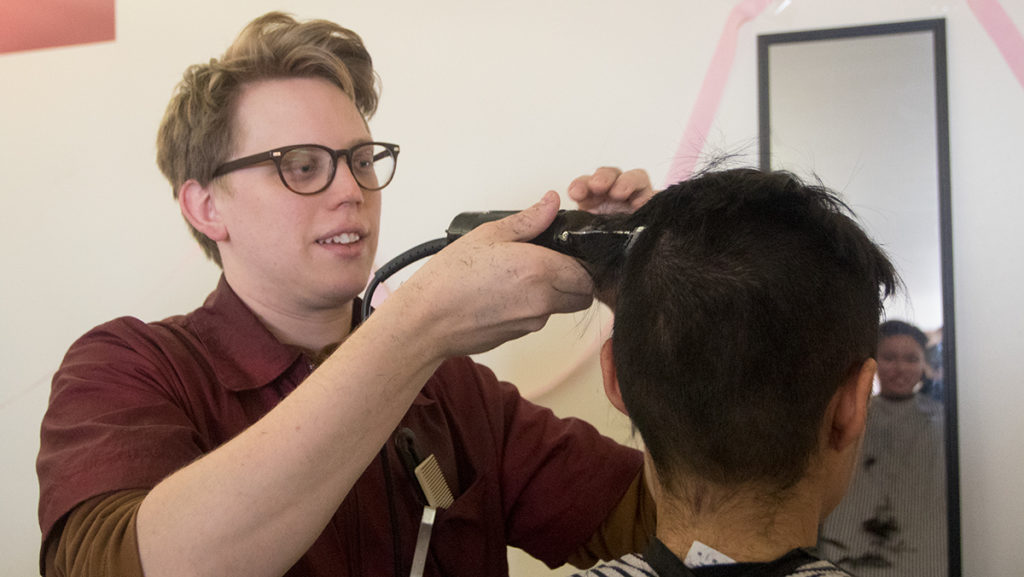 Professional hairdressers from Center Haircutters, Pesco Barber Shop, Hair It Is Salon and Karma Salon trimmed locks for the IC Hillel Inch-A-Thon. 