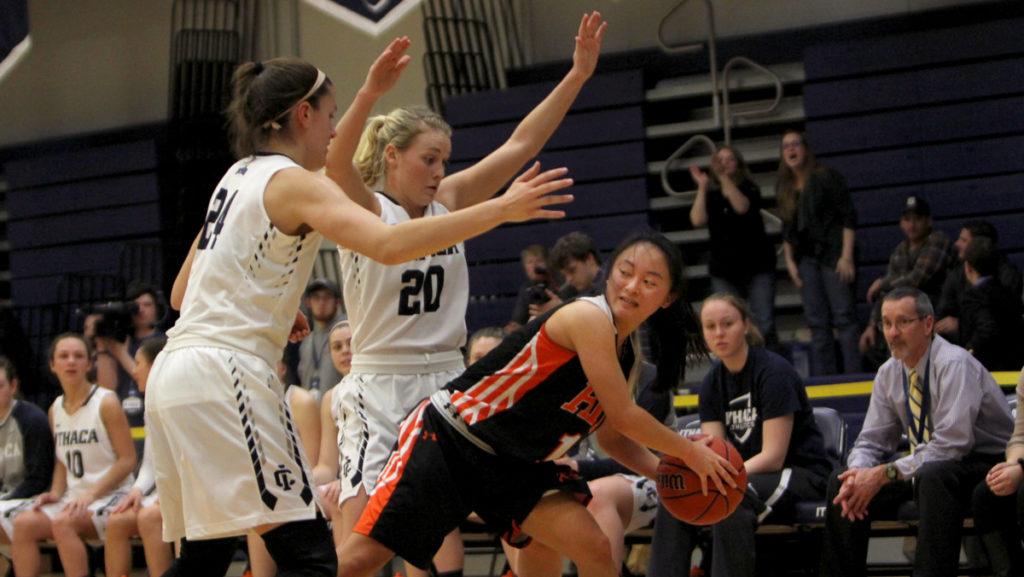 Junior guards Julie Yacovoni and Erin Woop double team Rochester Institute of Technology sophomore Cori Okada. 
