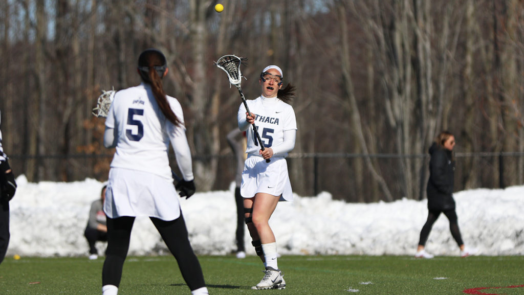 Graduate student attacker Ally Runyon passes the ball to sophomore attacker Allie Panara in their game against SUNY Cortland March 23. Runyon broke the all-time goals scored record in womens lacrosse against SUNY Geneseo April 7.