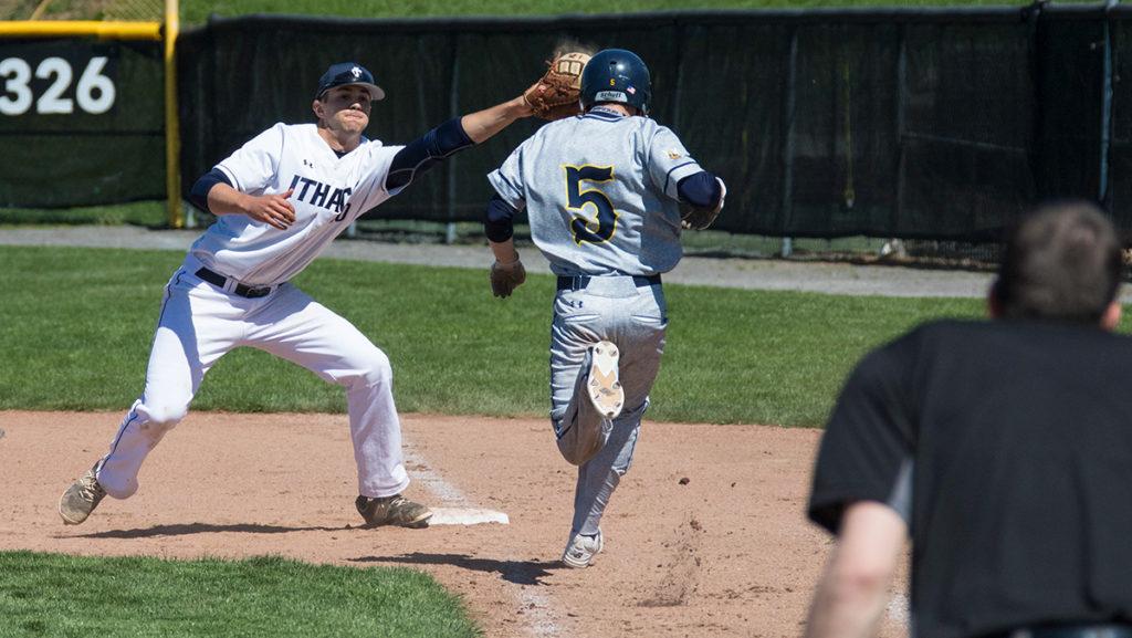 Sophomore+first+baseman+John+Peterson+stretching+across+the+base+line+to+get+freshman+outfielder+Kyle+Trombley+of+the+Yellowjackets+out+at+first+base+in+the+Bombers+game+against+the+University+of+Rochester.
