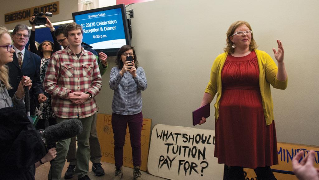 Assistant professor Megan Graham speaks during a silent protest March 2 outside the Emerson Suites. Graham writes about the three professors in the faculty union at the helm of a labor lawsuit alleging that the college fired them for their participation in the faculty union.