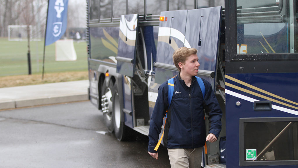Freshman Christopher Tinti gets on a bus April 7 to attend the Coach P Invitational in Bethlehem, Pennsylvania for track and field.