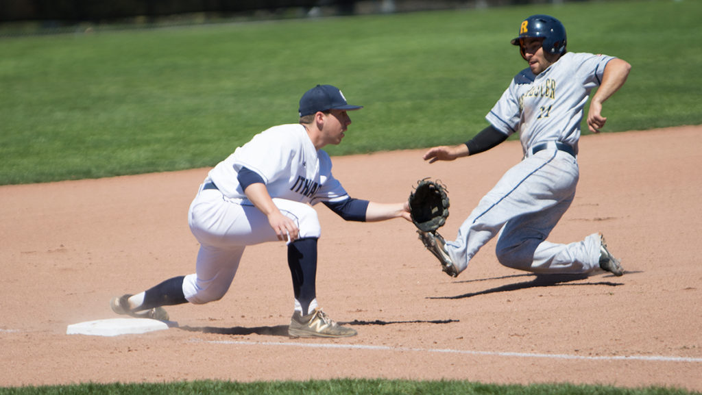 Senior third baseman Ryan Henchey is ready for the throw at third base to try to tag out freshman outfielder Jake Hertz of the University of Rochester in the Bombers 12–11 win April 23. The Yellowjackets are apart of the Liberty League Conference.