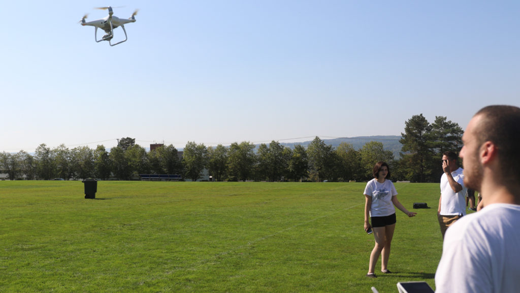 Sophomore Varek Mouradian practices flying a drone. The Ithaca College Roy H. Park School of Communications received five new drones funded by a private donor.