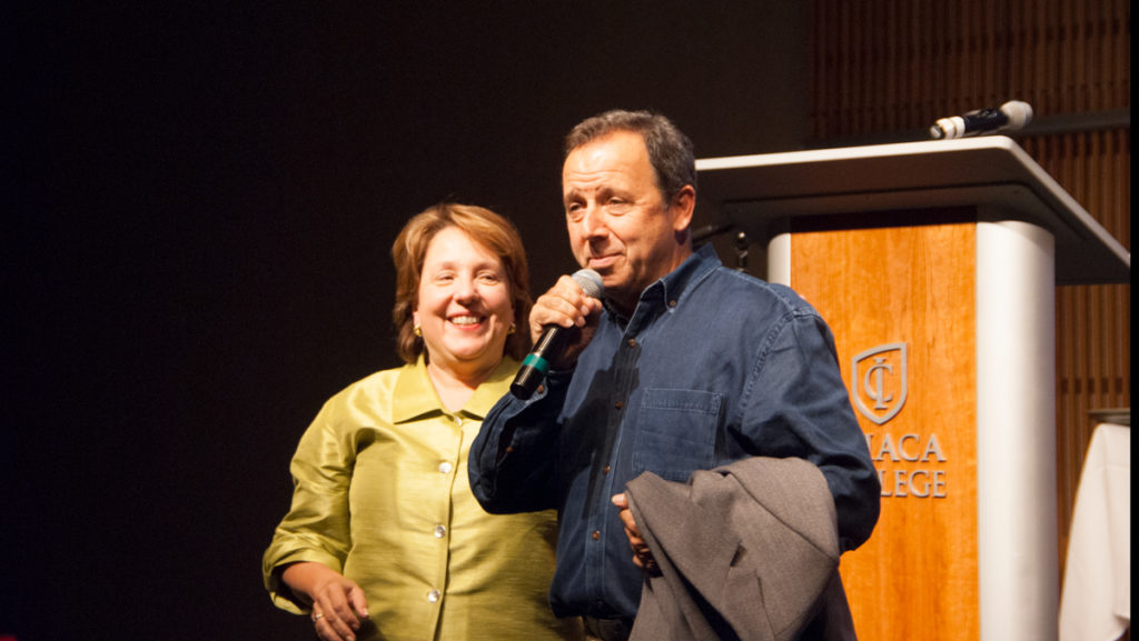 From left, Diane Gayeski, dean of the Roy H. Park School of Communications, stands with Ron Suskind, an award-winning journalist, as he addresses a crowd of students during a speech he gave Sept. 28 about alternative communication skills he learned through working with his autistic son. 