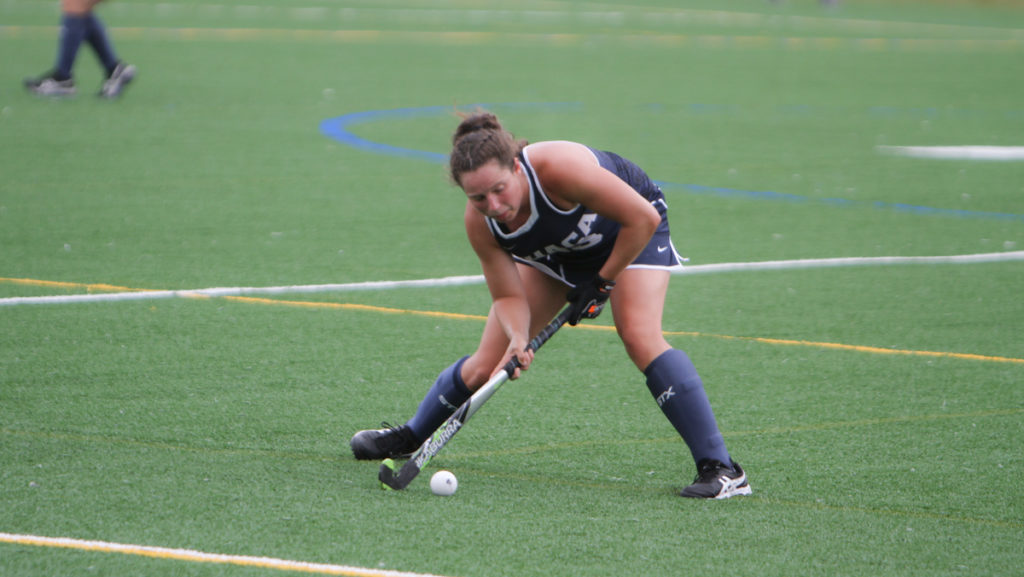 Junior midfielder and back Kaylou Stoddard looks to pass the ball in the field hockey teams game against Hartwick College Sept. 13. The Bombers defeated the Hawks 3–1. When shes not at field hockey, shes playing lacrosse.