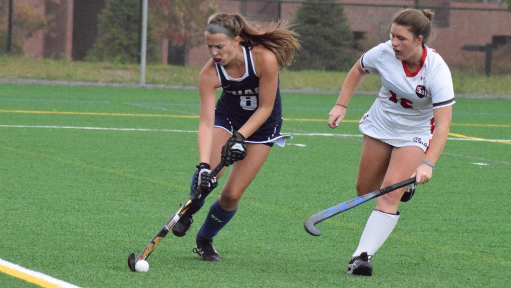 Junior strikers Meg Dowd corrals the ball as senior defender Molly Wood of St. Lawrence tries to cut Dowd off. The Bombers defeated the Saints 2–1 at Higgins Stadium.