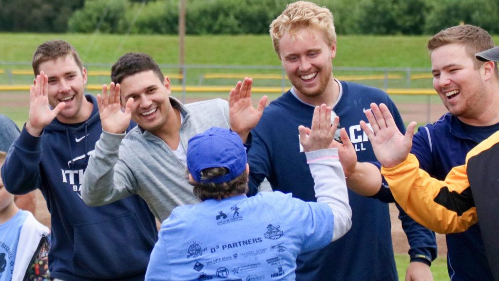 From left, junior pitcher Matt Eiel, senior second baseman Nick Skerpon,  senior pitcher Tyler Hill and junior first baseman Jackson Smith participated in the Dave Clark Foundation Dream and Do Day on Sept. 9.