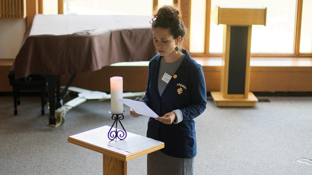 Hillel Executive Director Lauren Goldberg reads a Jewish prayer Sept. 11 written by poet Alden Solovy. The service also featured a Christian prayer and a Muslim prayer.  A moment of silent prayer was held in remembrance of the victims of the attacks.