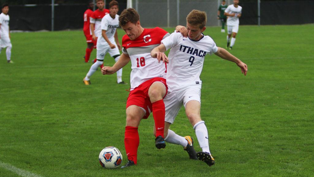 Sophomore forward Max Barish and sophomore defender Garrett Sweeney of SUNY Cortland battle for the ball during the Bombers home opener against the Red Dragons, losing the game 1–0. 