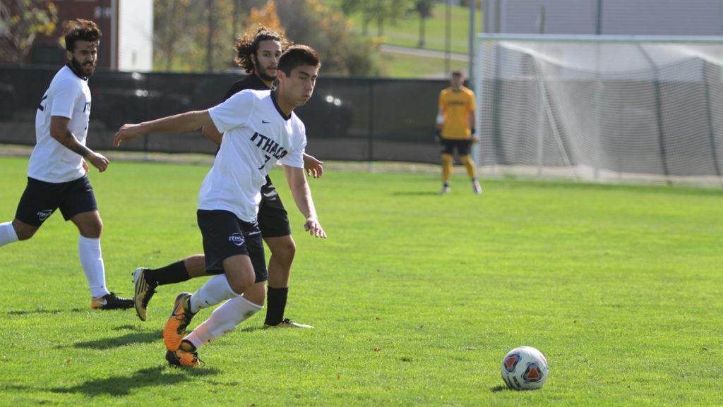 Sophomore midfielder Justinian Michaels looks to go get the ball during the teams game against Bard College. The Bombers defeated the Raptors 5–0.