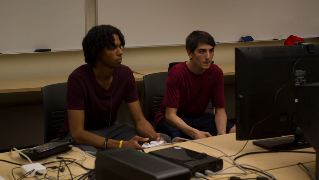 From left, seniors Lucas Nicholas and Nigel Nelson compete in Smash Clubs “Super Smash Bros.” tournament on Oct. 8. “Super Smash Bros.” is a fighting game series developed by Japanese game developer Nintendo.