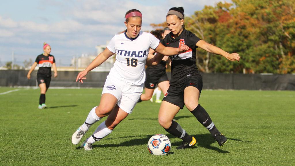 Junior forward Sarah Pirnie pushes junior defender Riley Yankowich of RIT out of the way from getting to the ball. The Bombers lost to the Tigers 1–0 at Carp Wood Field.	 