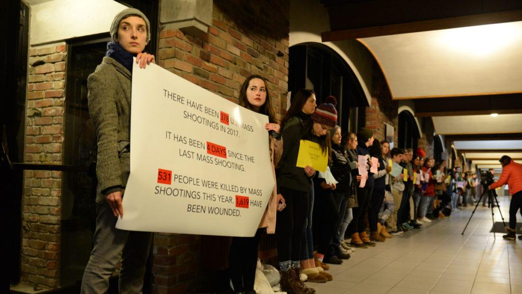 Students lined the hallway in Textor, protesting Larry Pratt, a conservative gun advocate who spoke at the college Nov. 9. 