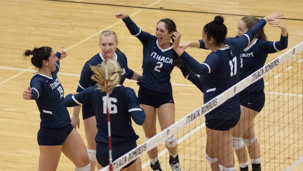 he volleyball team celebrates together after scoring during its game against Alfred University on Sept. 30.  The Bombers defeated the Saxons 3–0 with scores of 25–9, 25–9 and 25–13 in Ben Light Gymnasium.