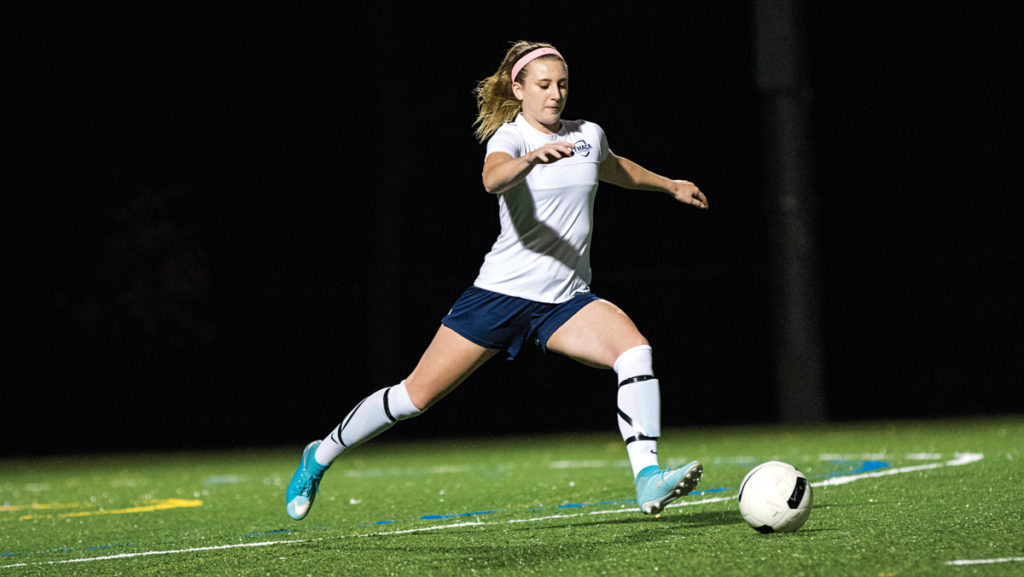 Sophomore defender Anna Soles runs to kick the ball during the women’s club soccer team’s game against Cornell University on Oct. 13. The team will compete at the National Championship in Arizona Nov. 16–18.