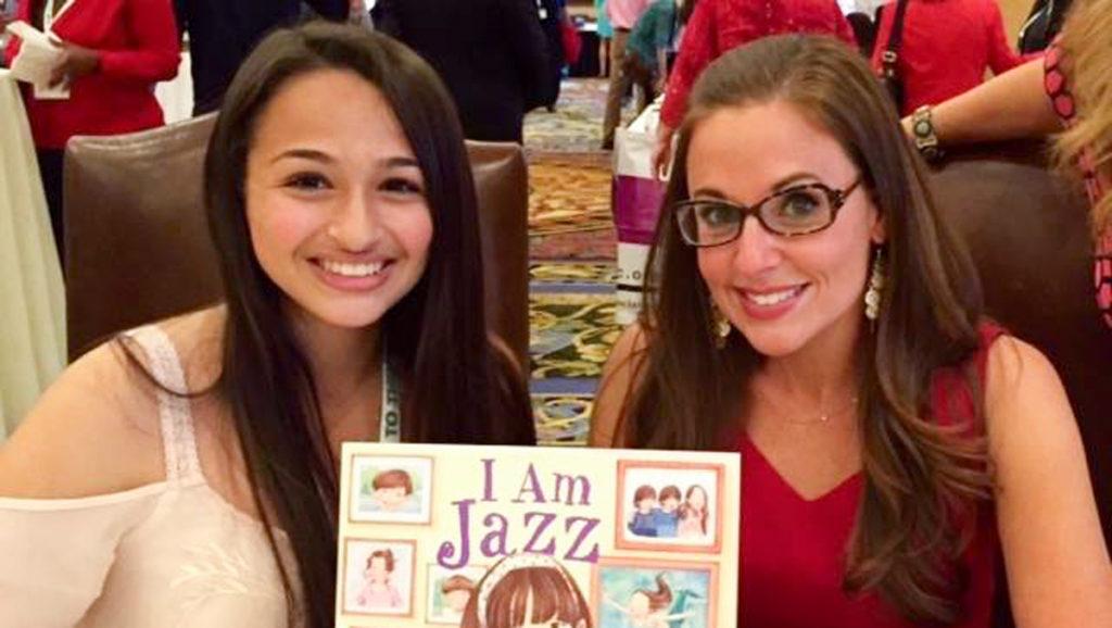 Jazz Jennings and Jessica Herthel, author of I am Jazz hold up the childrens picture book based off of Jazz Jennings life. The book is the first childrens picture book to tell a biography of a transgender child. 