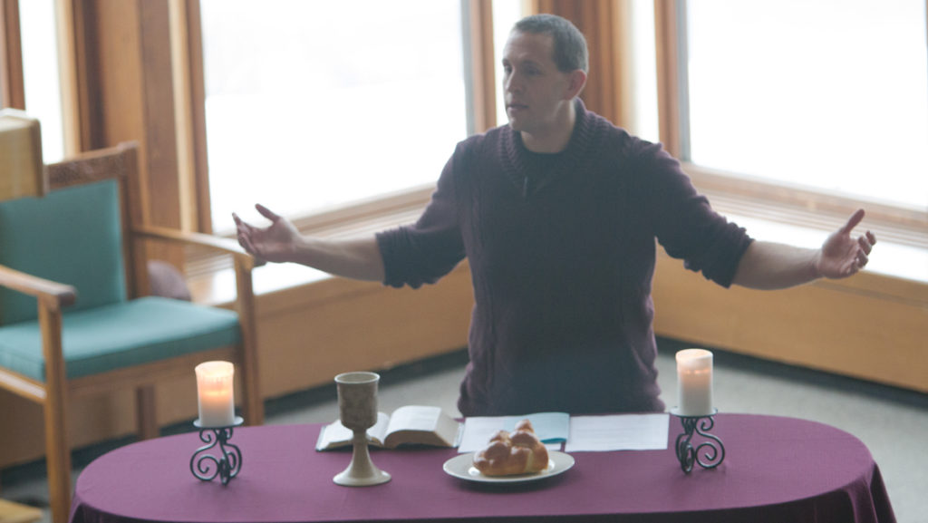James Touchton, protestant chaplain and current Interfaith Council advisor, leads a Refuge service at Muller Chapel Dec. 12. Touchton said the number of practicing Protestants on campus ranges from about 75 to 80 students.