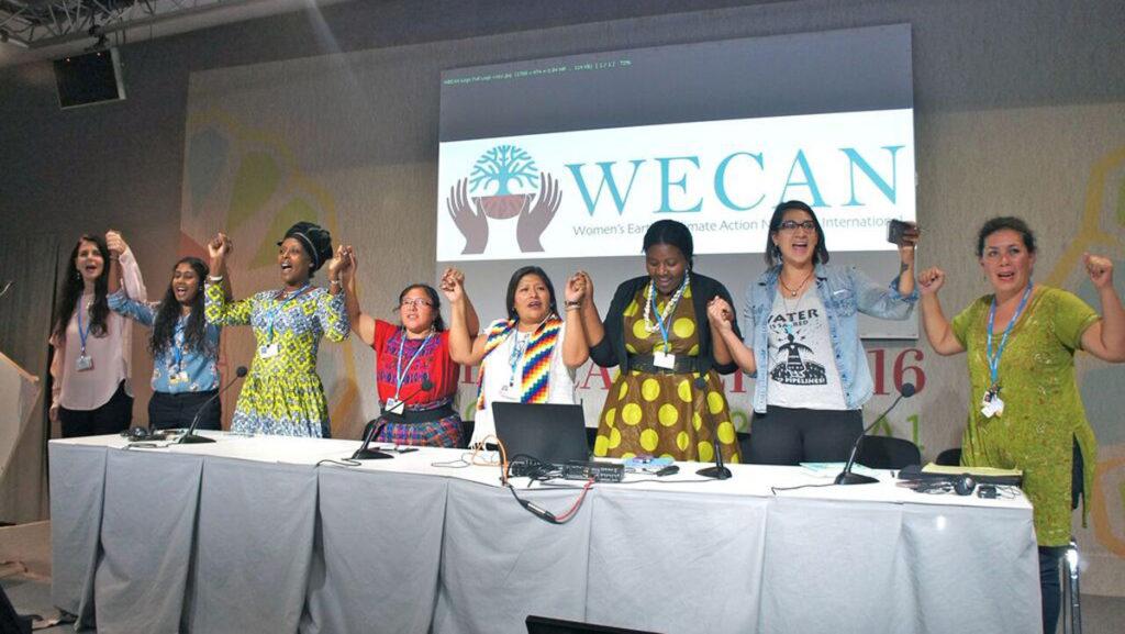 At COP22 in 2016, representatives from the Women’s Earth & Climate Action Network host a side event as speakers stand together in solidarity and action. WECAN partners with the college to share seats at the annual UN Climate Conferences. 