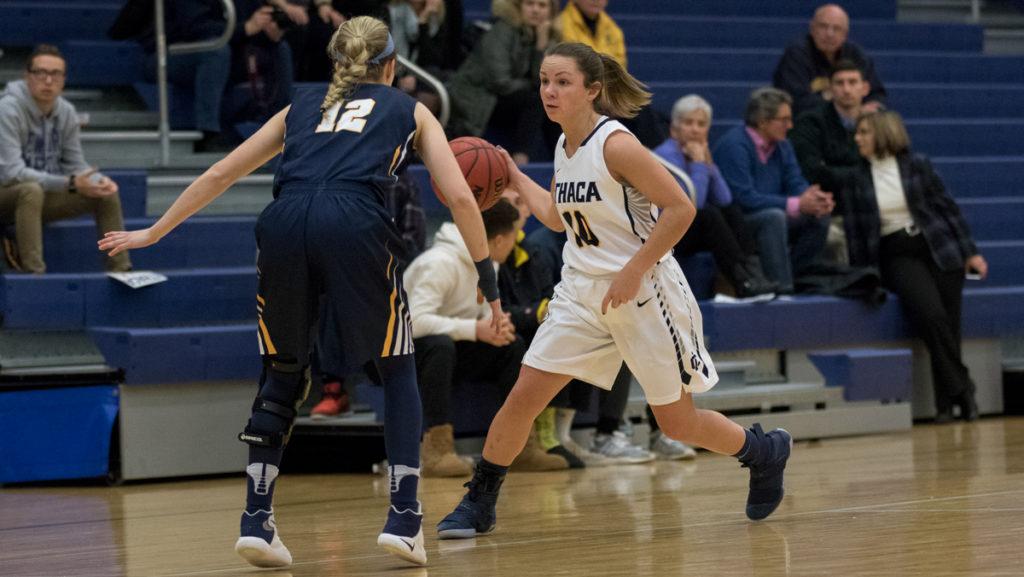 Junior+guard+Annie+Giannone+dribbles+against+University+of+Rochester+senior+guard+Brynn+Lauer+during+the+game+on+Dec.+12