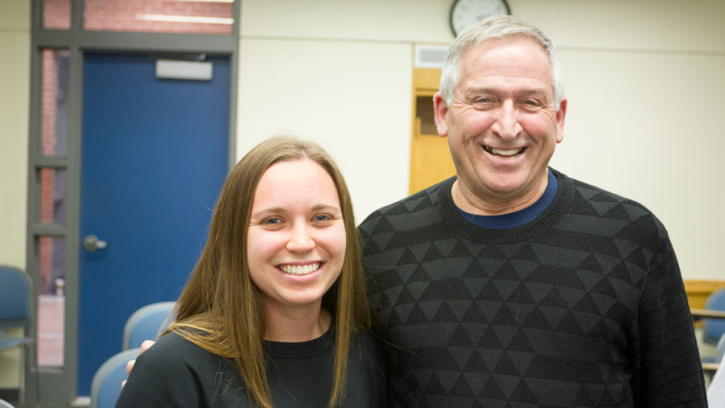 Junior back Madeleine Keppel stands next to the field hockey team mentor, Stephen Mosher. The faculty mentor program started in 2015.